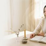 woman seated at wooden table 202608131536